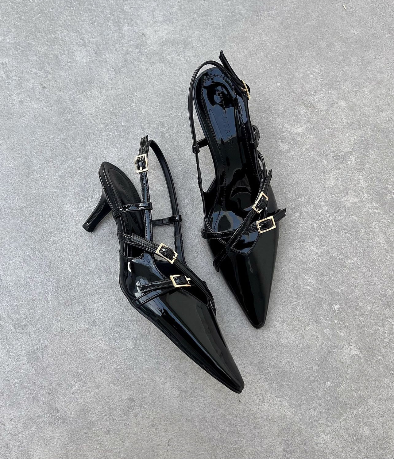 Blade embellished patent-leather slingback pumps