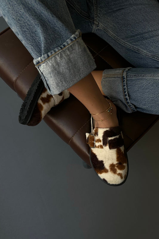 WOMEN'S COW PRINT MULES CLOGS