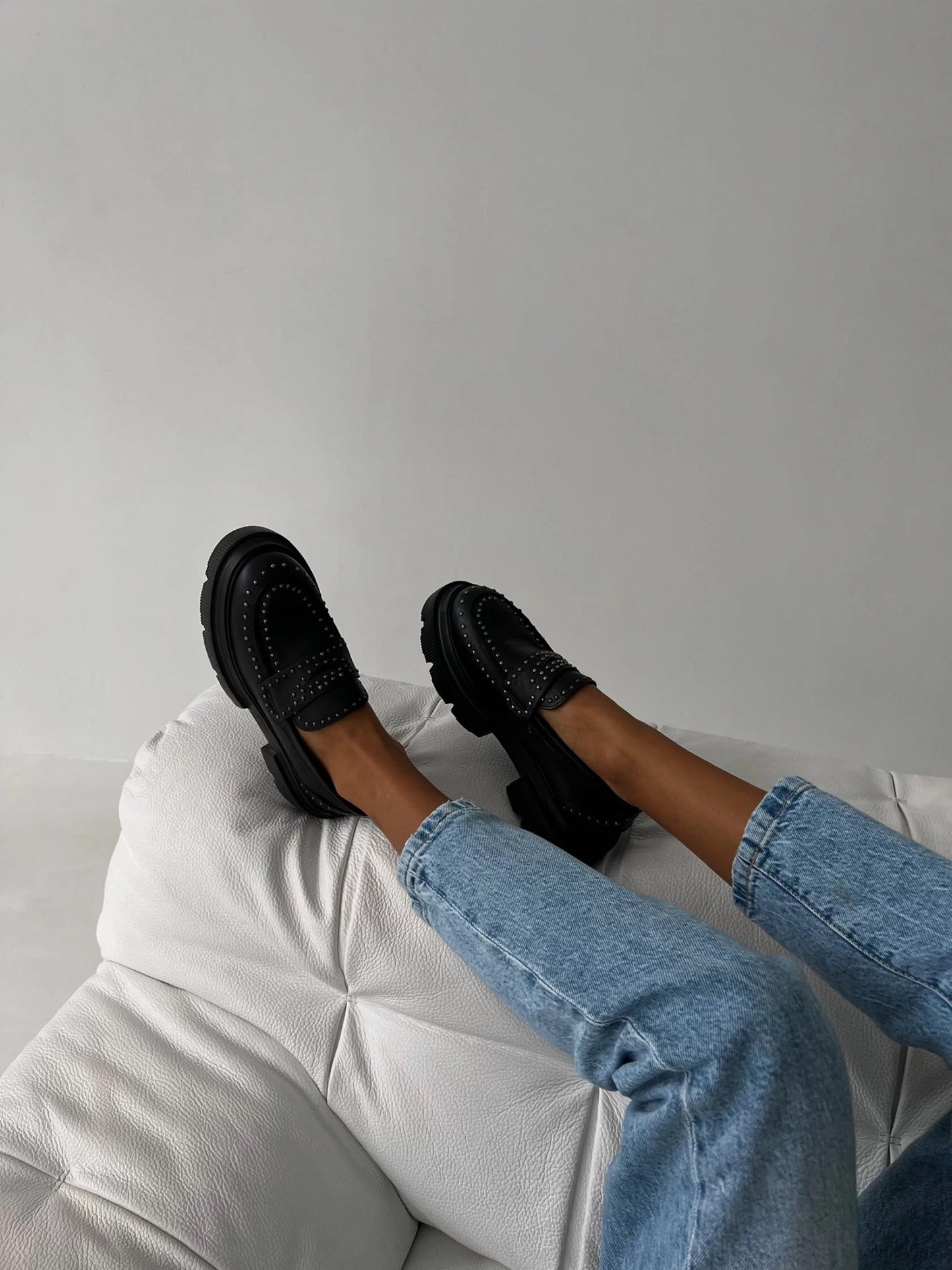 Chunky black loafers with studs