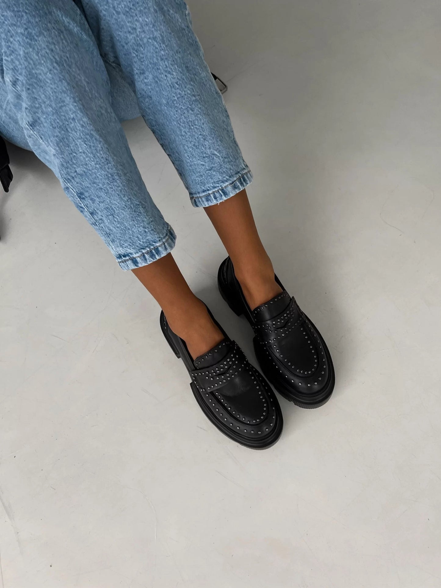 Chunky black loafers with studs